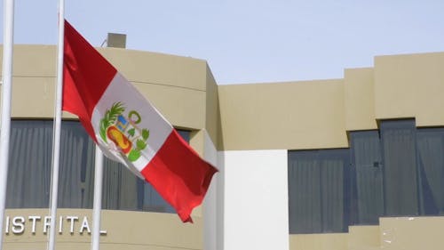 Peru National Flag In Front Of Administration Building