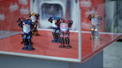 Close Up Video of Miniature Robots Doing Movements in Sync