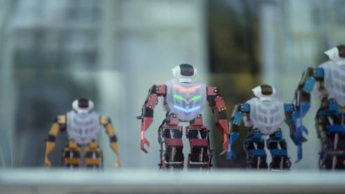 Close Up Video of Miniature Robots Doing Movements in Sync