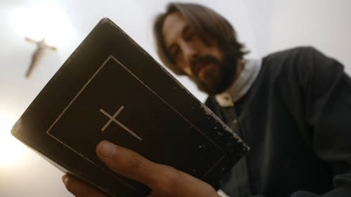 Man holding a Bible