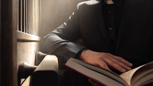 Close up Shot of a Man Reading a Book