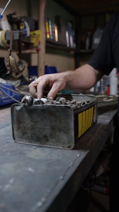 A Mechanic Searching for Bolts and Screws