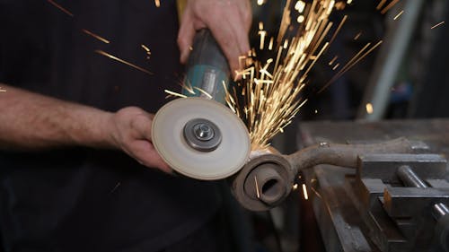 Person using Angle Grinder