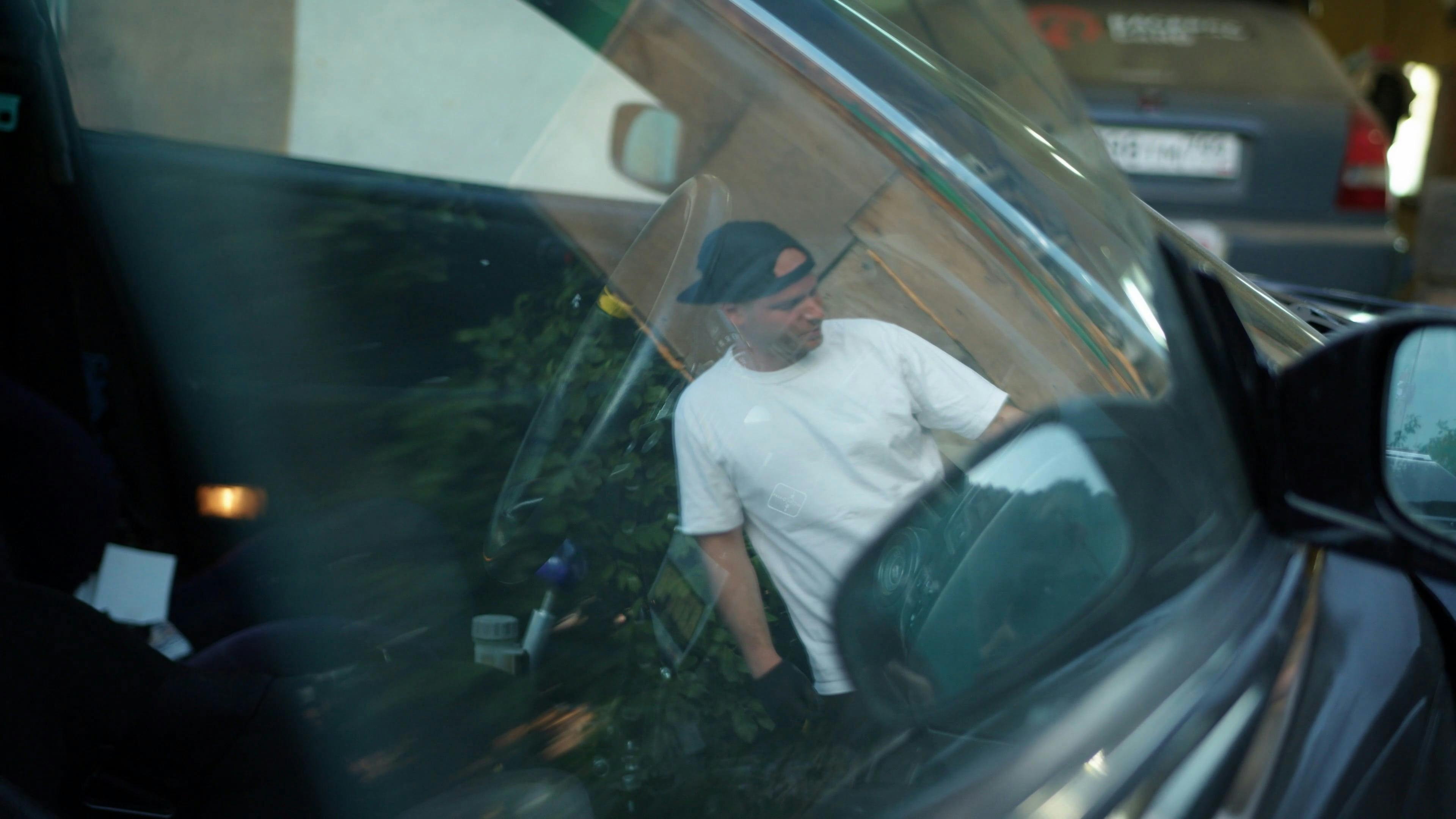 Reflection Of a Man Opening The Hood of a Car \u00b7 Free Stock Video