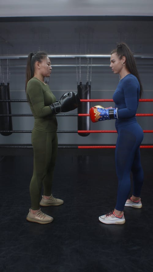 Boxer and Coach Practicing Touch Gloves