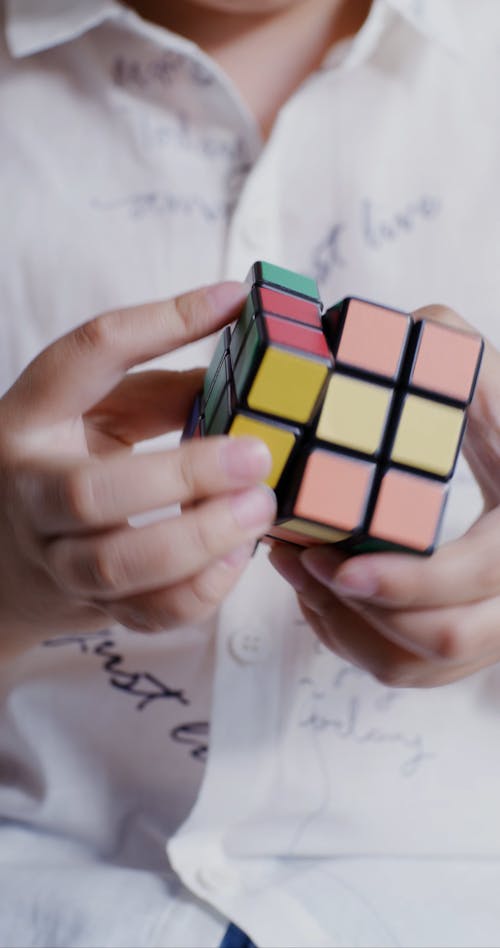 Person Using a Rubik's Cube