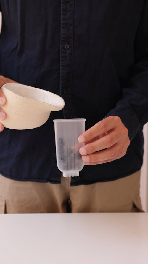 A Person Preparing Homemade Popsicle 