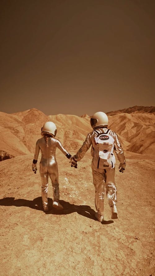 An Astronaut Couple Walking on Mars