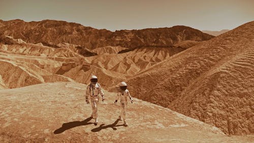 Astronauts Walking in a Desolate Area