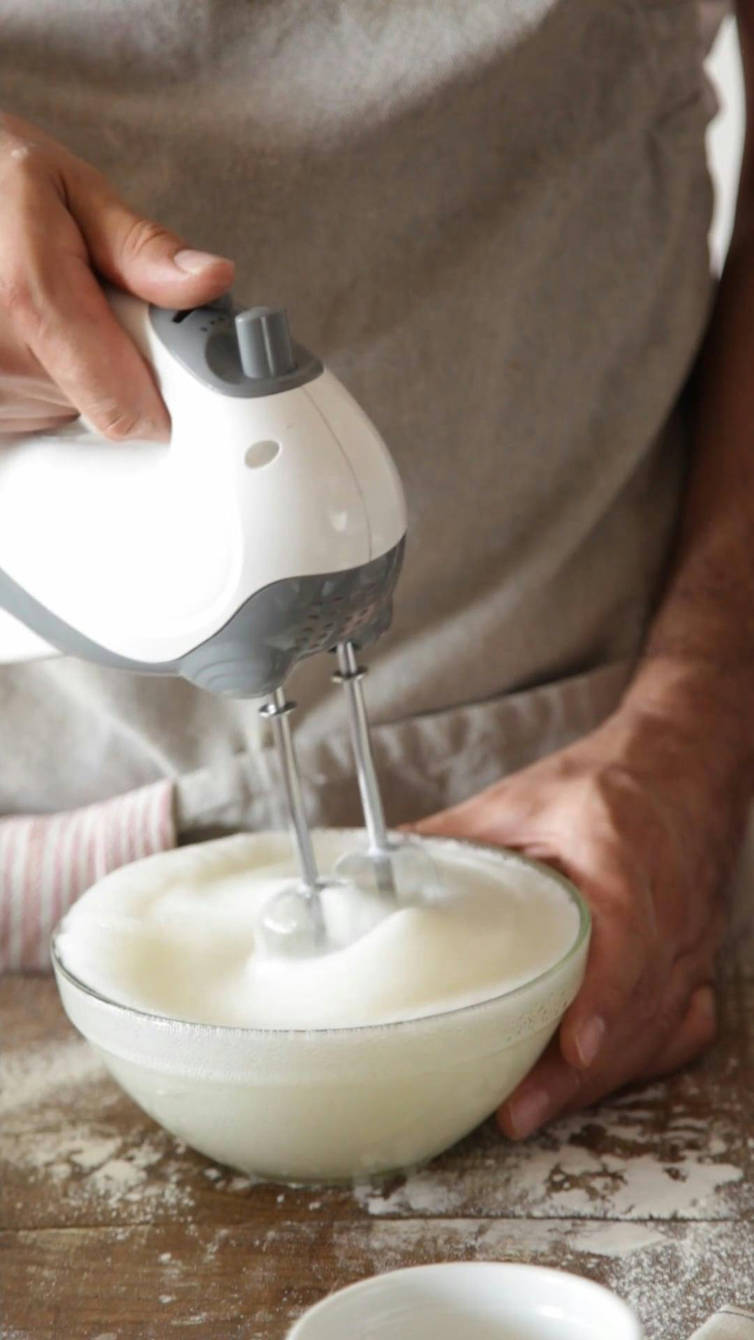 A Person Using a Hand Mixer · Free Stock Video