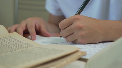 Close Up video of a Person Writing