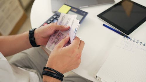 Close Up Video of a Person Counting Money