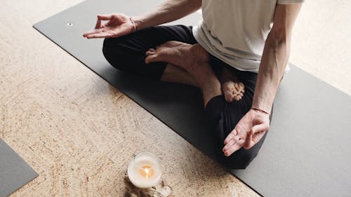 A Person Meditating on the Floor