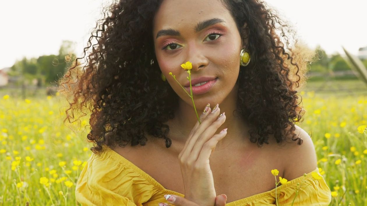 A Woman Holding Yellow Flowers Free Stock Video Footage, Royalty-Free ...