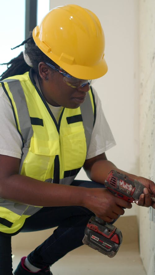 Woman Using a Hand Drill