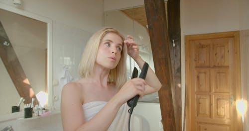 Person Straightening her Hair