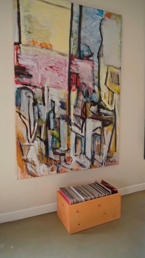 A Colorful Abstract Painting Hanging on the Wall