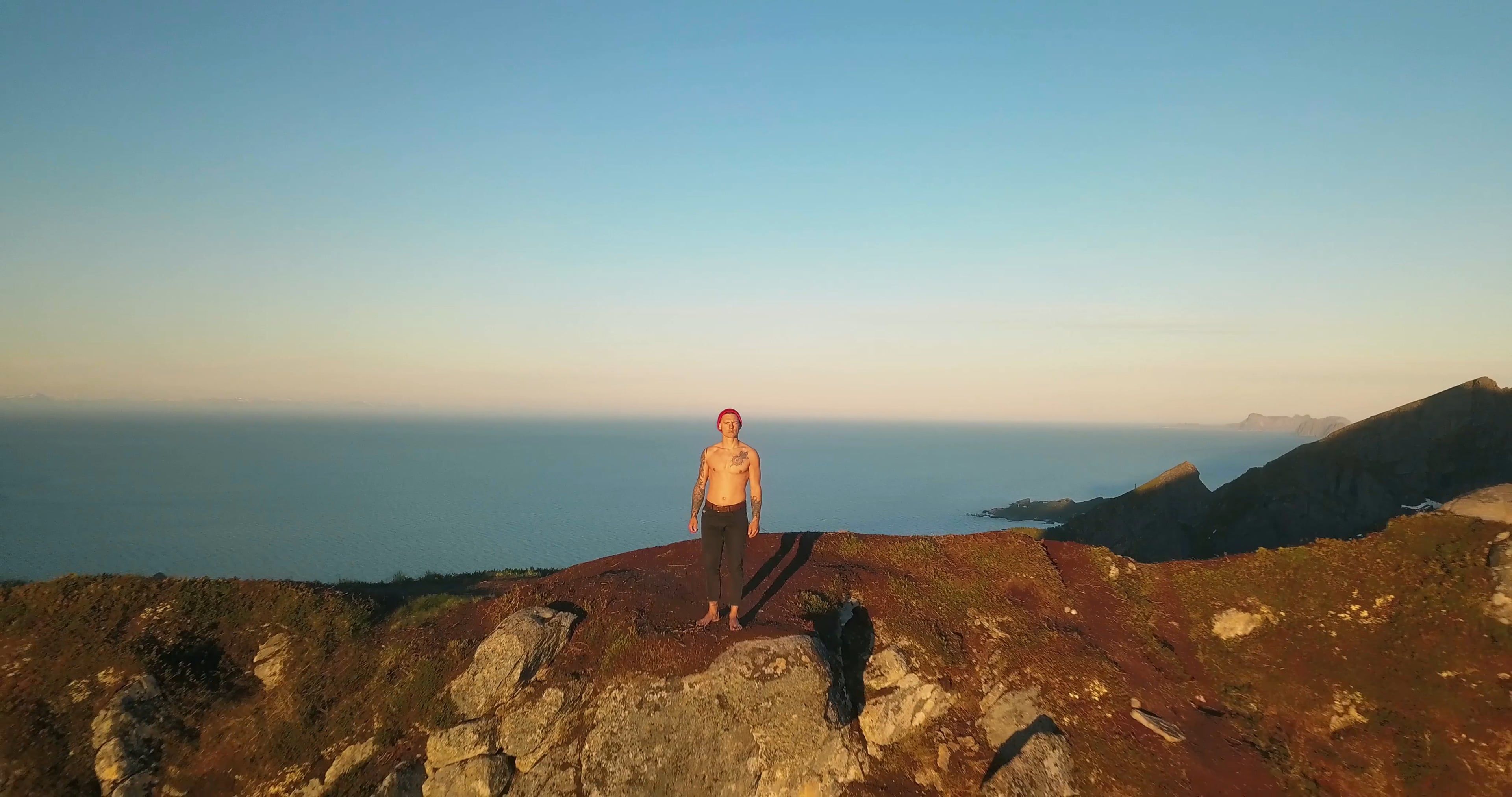 Drone Footage of a Man Standing on a Mountain · Free Stock Video