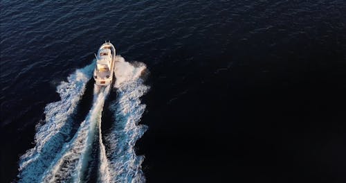 Drone Footage of a Boat Headed for an Island