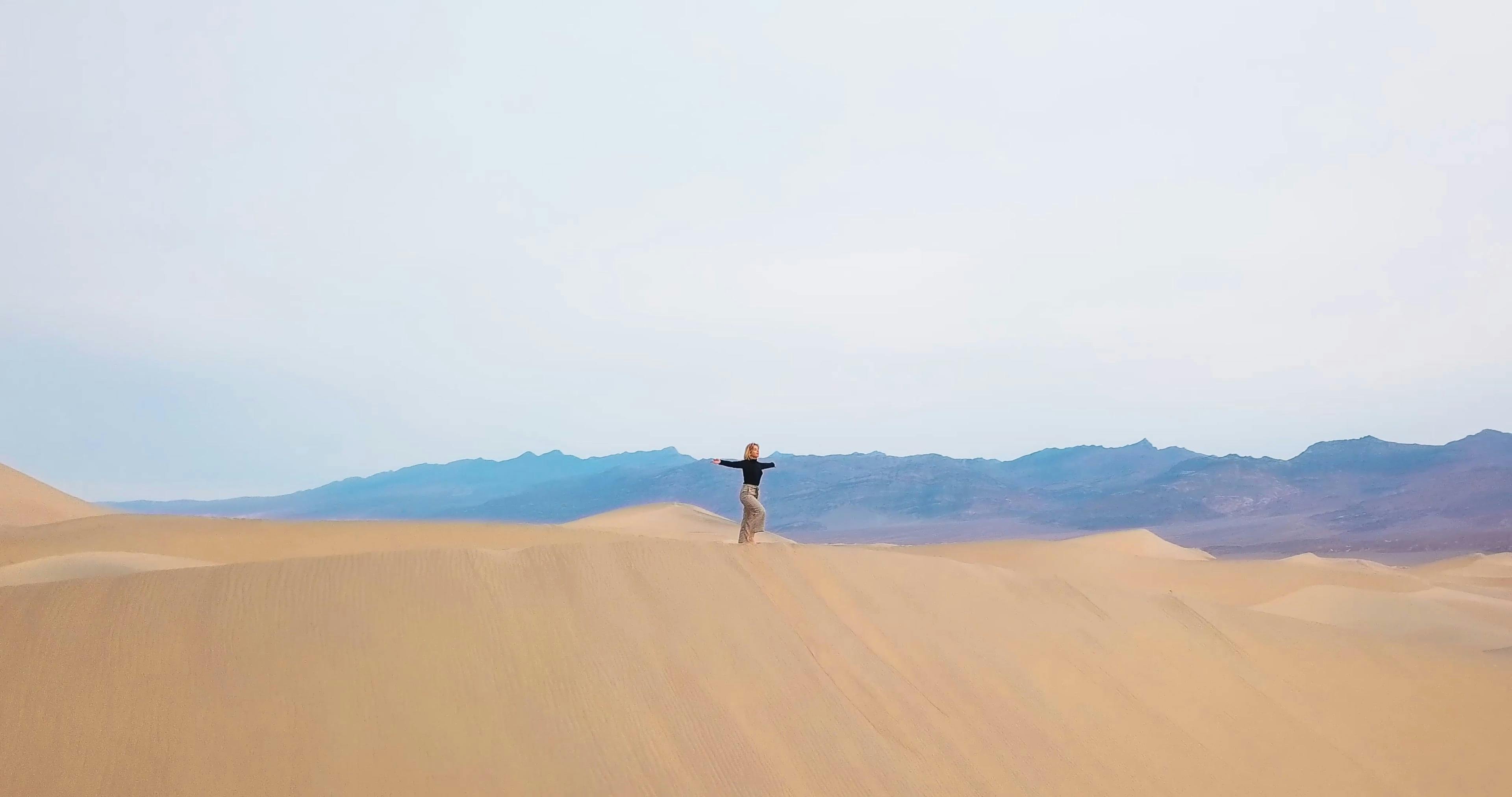 A Woman Standing Alone in the Dessert · Free Stock Video