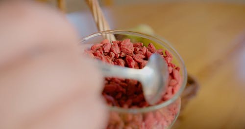 Dried Goji Berries Being Placed on top of a Shake