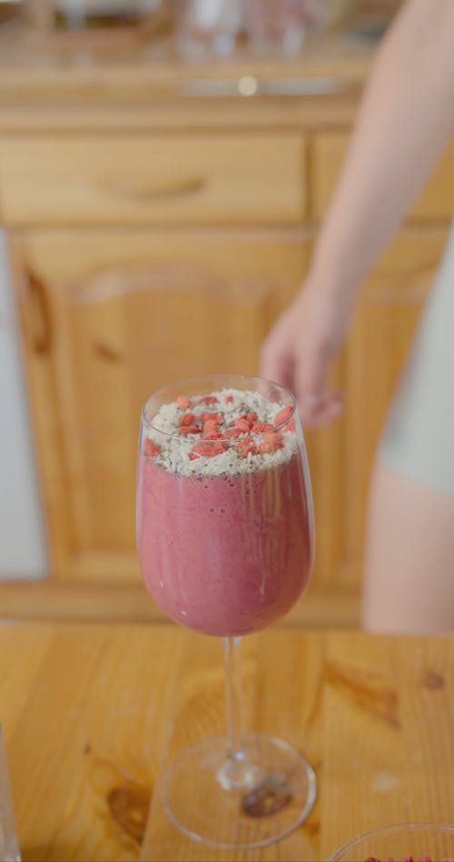 A Woman Getting a Fruit Shake in a Kitchen