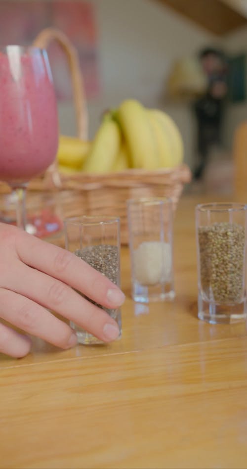 Chia Seeds Being Sprinkled on Top of a Shake