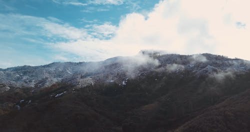 Drone Footage Of Clouds In a Mountain
