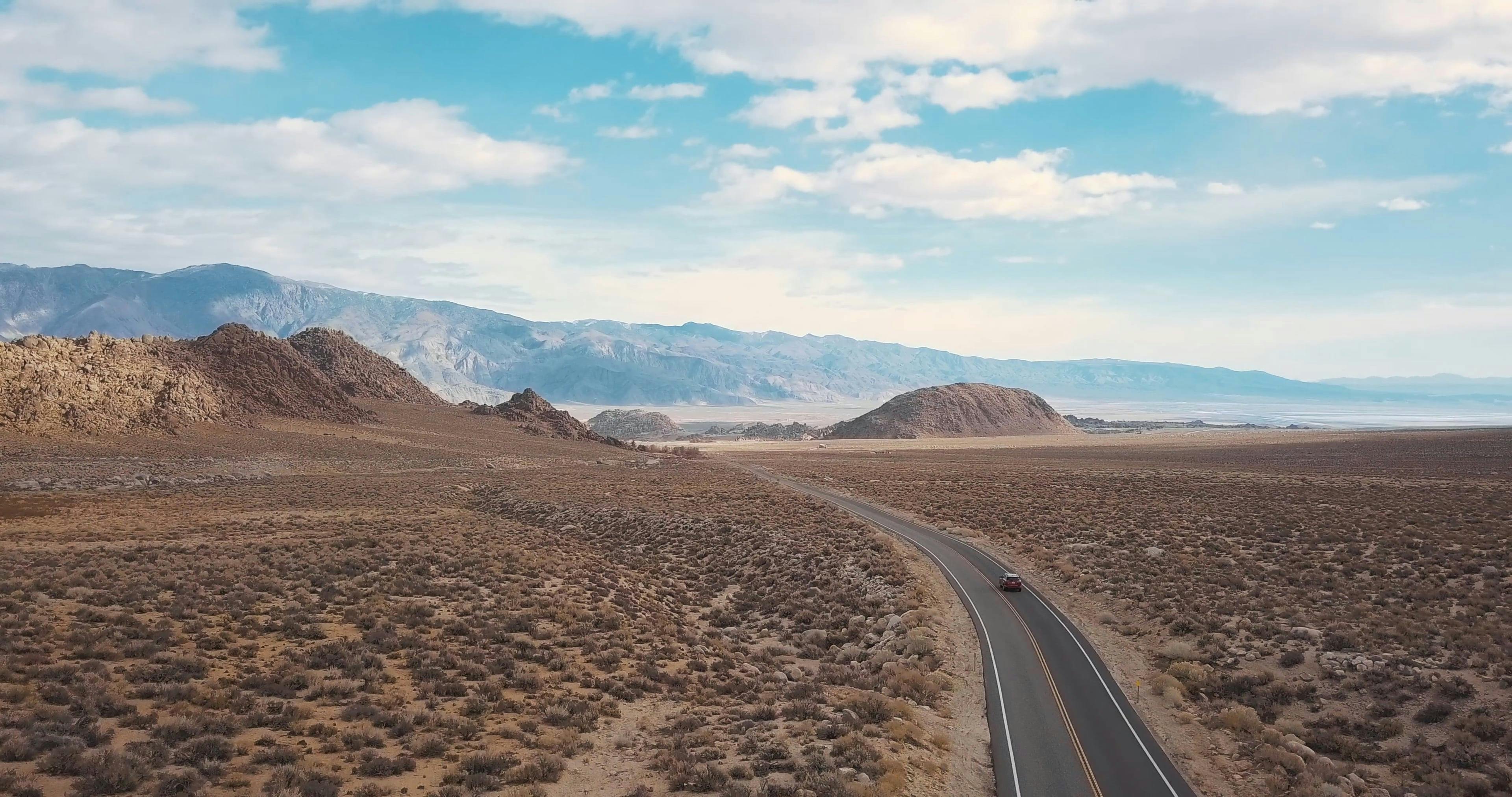 aerial-footage-of-a-car-on-the-road-free-stock-video