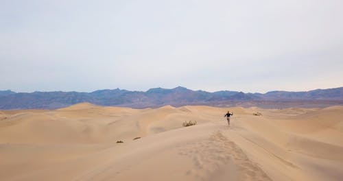 Woman Running on Dune