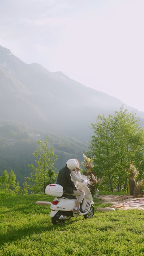 A Couple Sitting on a Motorcycle