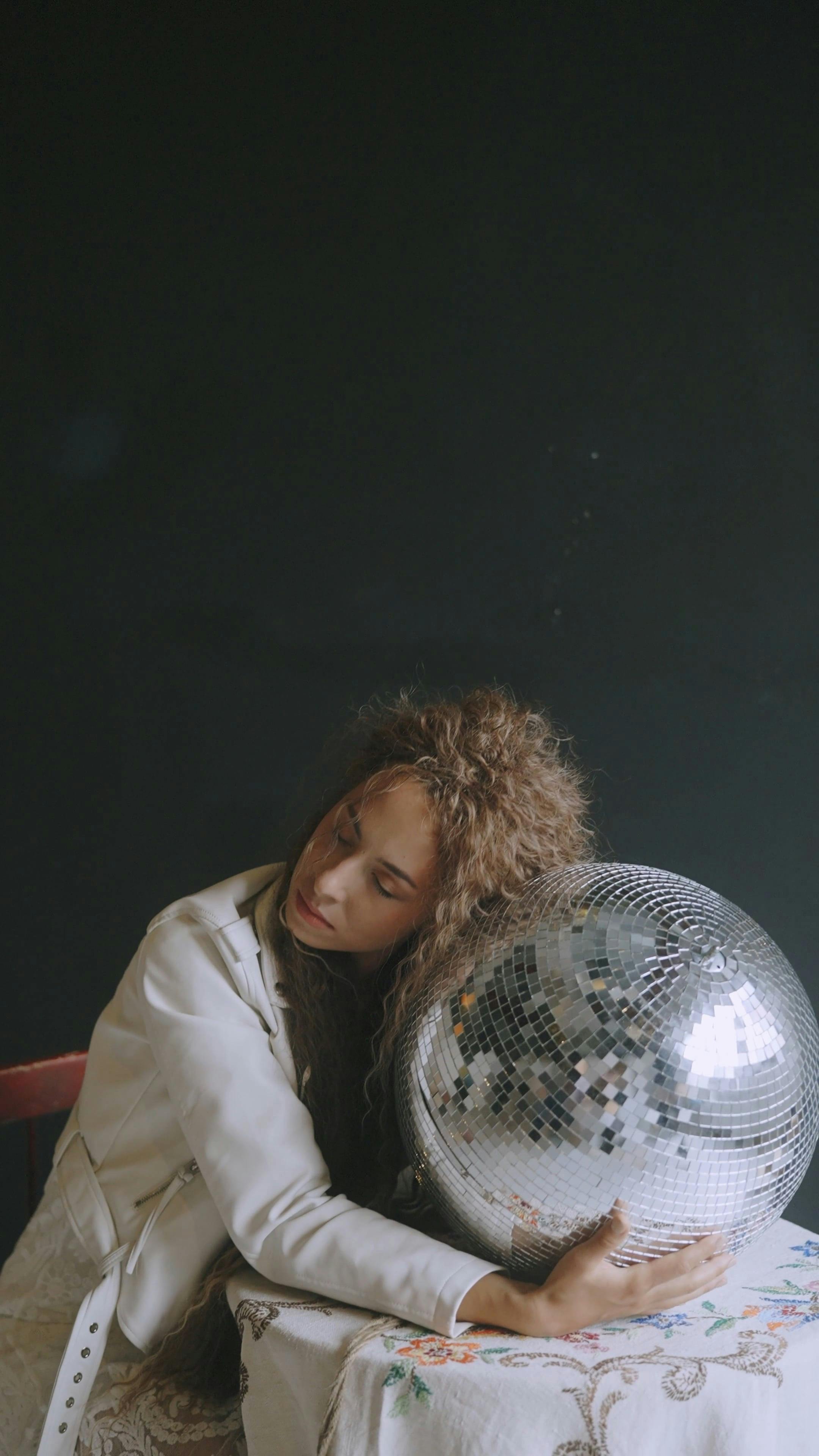 Woman Hugging a Disco Ball · Free Stock Video