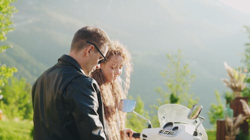 A Couple Riding a Motorcycle