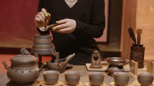 A Person Preparing Tea