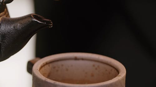 A Close Up of Tea being Poured into a Cup