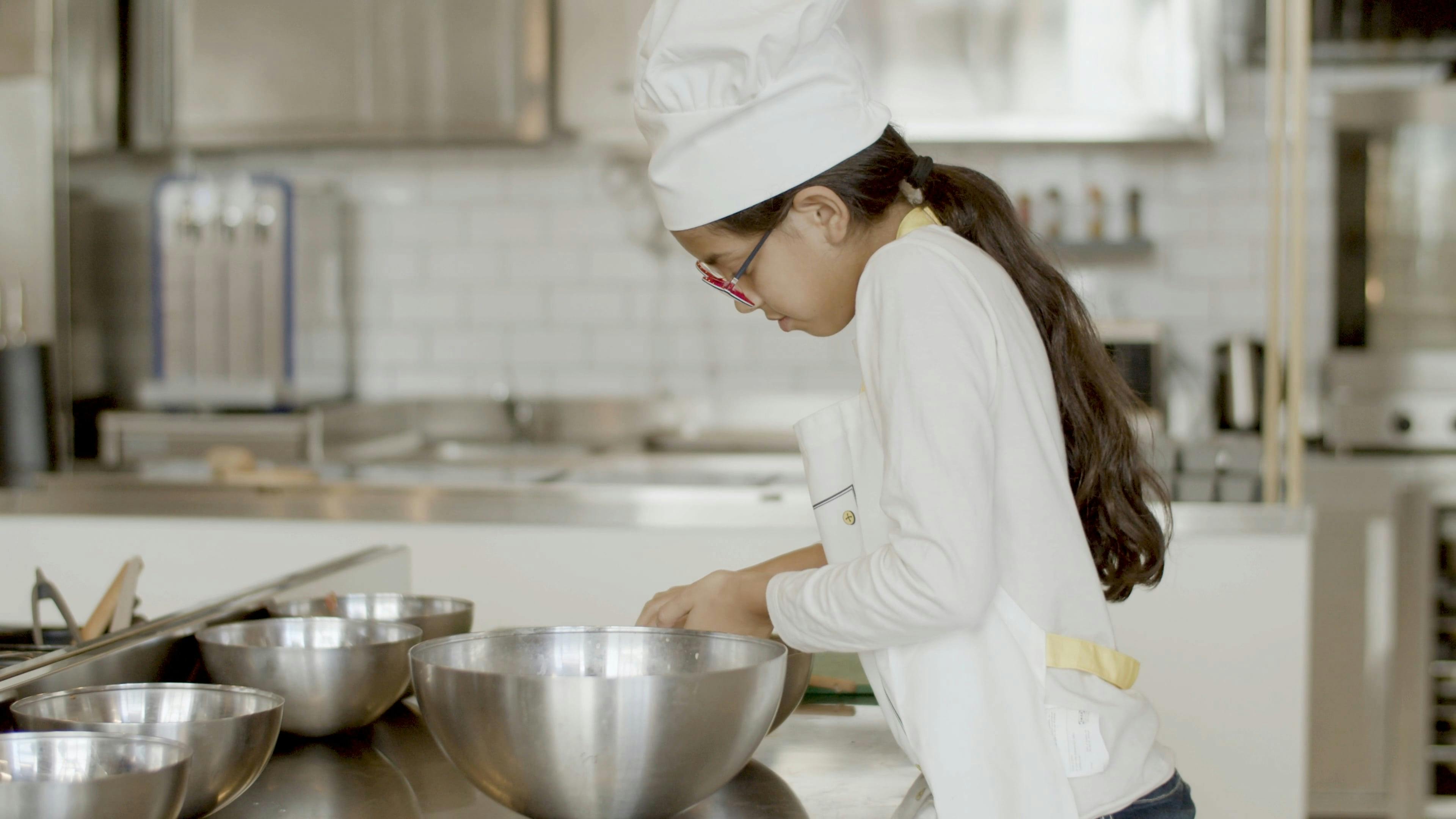Girl Preparing Food at the Kitchen · Free Stock Video