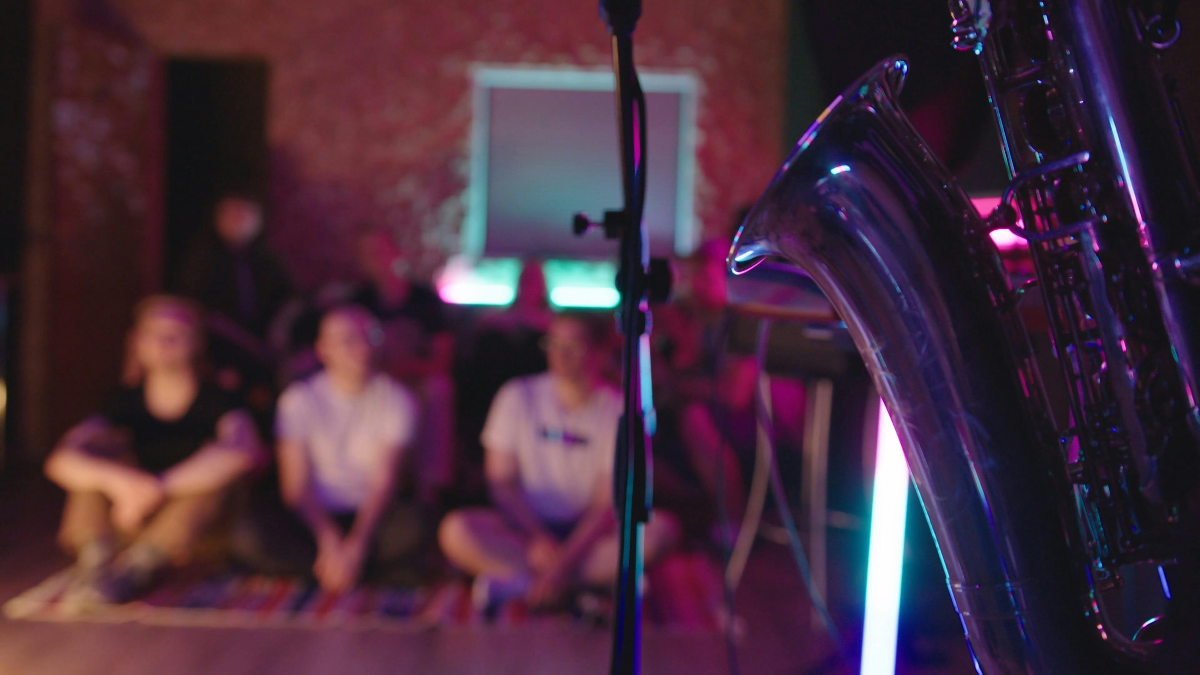 A Group of People in a Room Watching a Concert · Free Stock Video