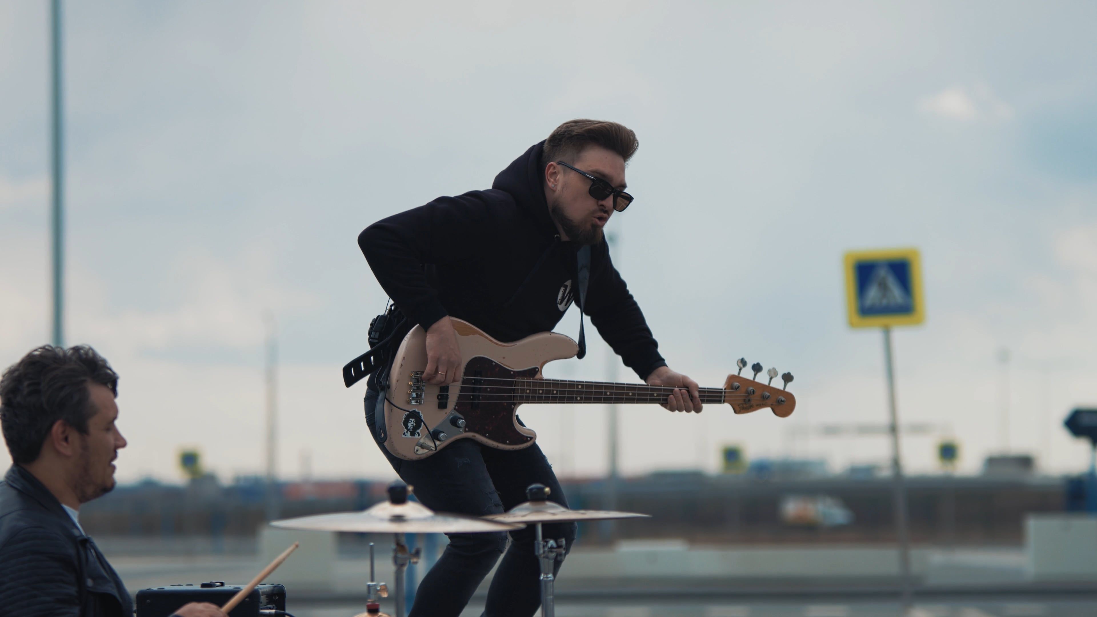 A Man Jumping While Carrying Bass Guitar Free Stock Video Footage ...