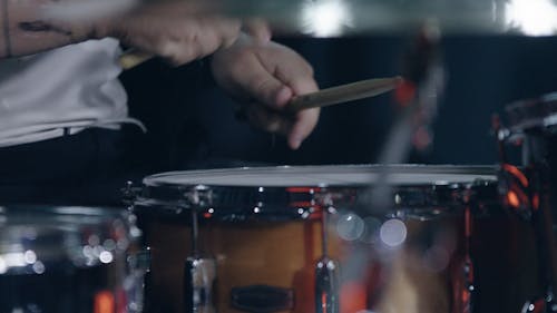 Close Up Video of a Person Playing Drums