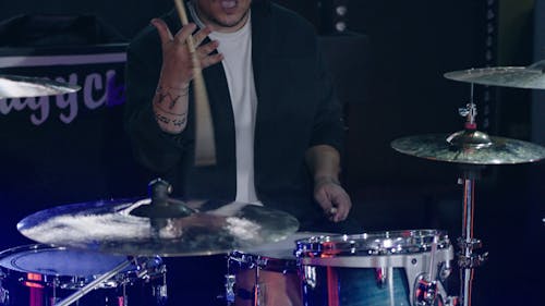 A Man Spinning the Drumstick