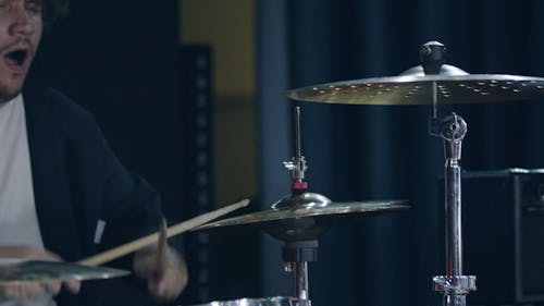 Close-up Footage of a Drummer Performing