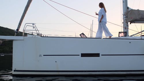 A Woman Standing on the Boat