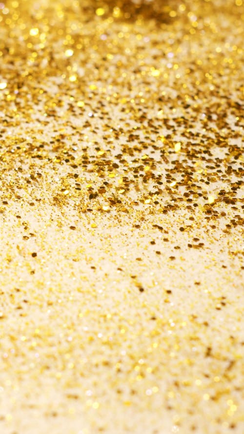 Tiny Golden Objects Falling on a Surface