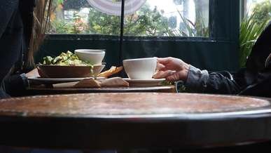 people being served their food and getting ready to eat
