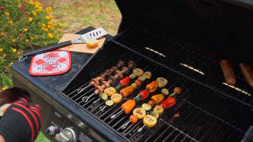 A Person Grilling Vegetables 