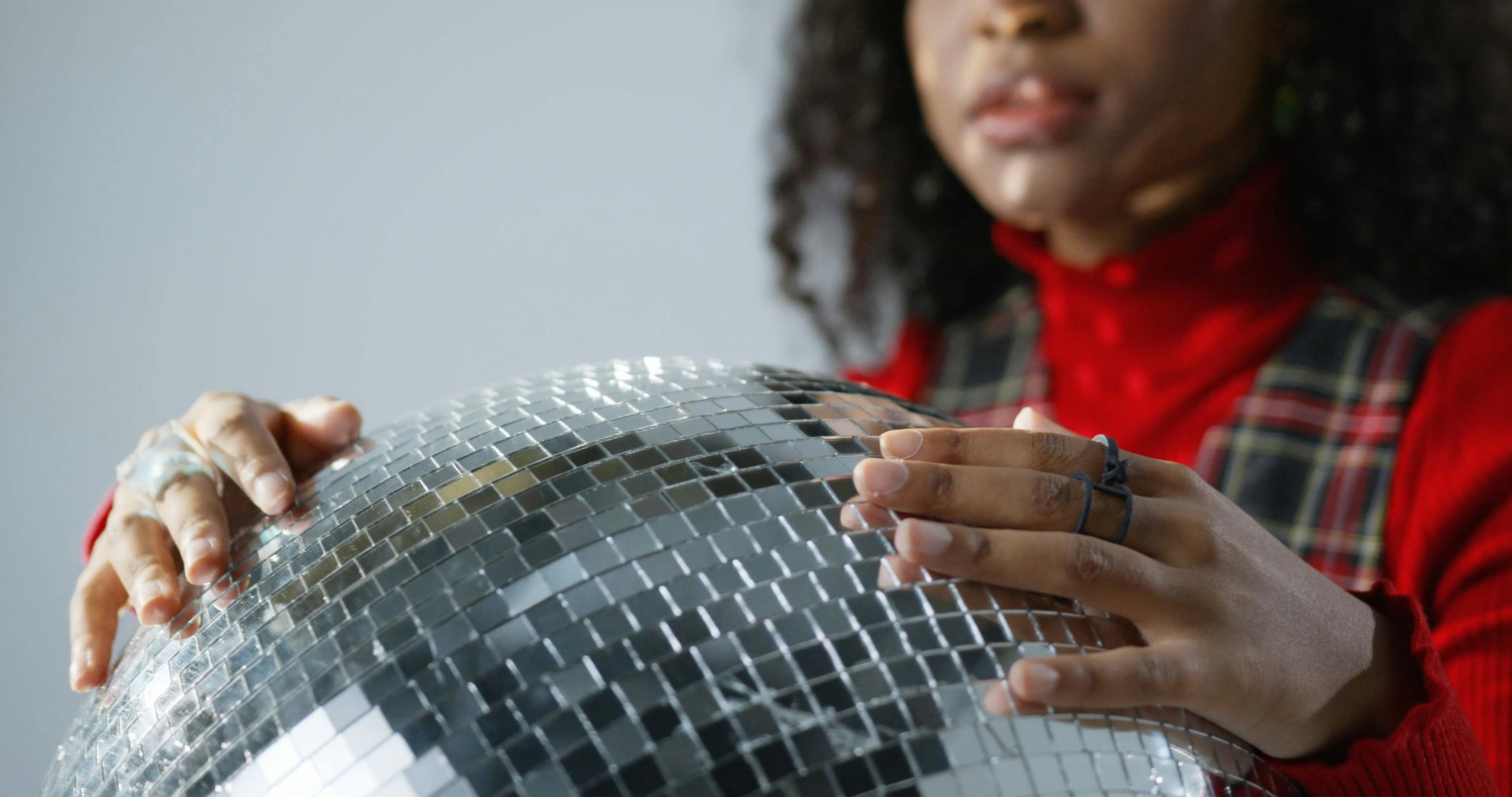 Girl Holding a Disco Ball · Free Stock Video