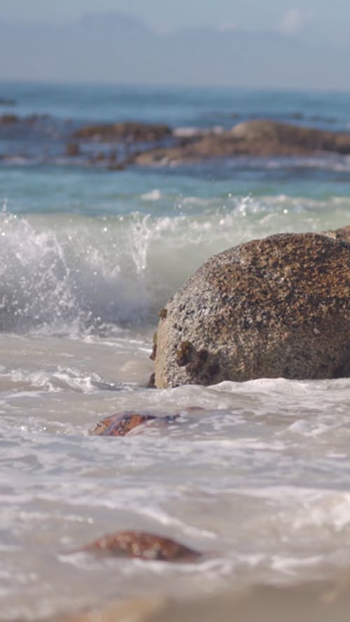 Waves Crashing on Boulders