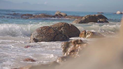 Waves Crashing on Boulders