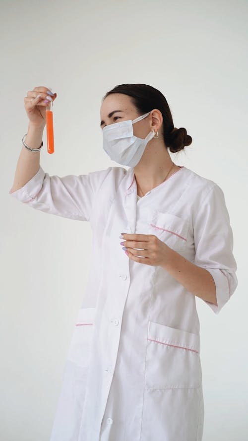 Scientist Holding a Test Tube with Chemical