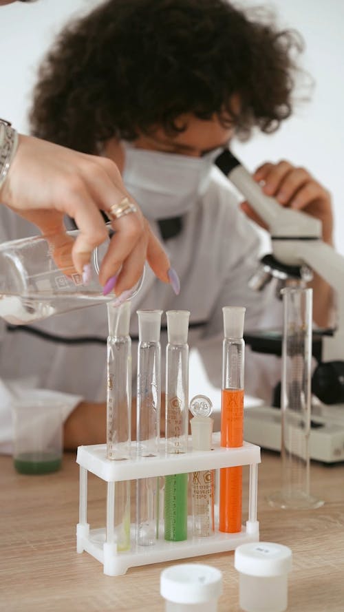 Person Pouring Liquid from the Test Tube · Free Stock Video